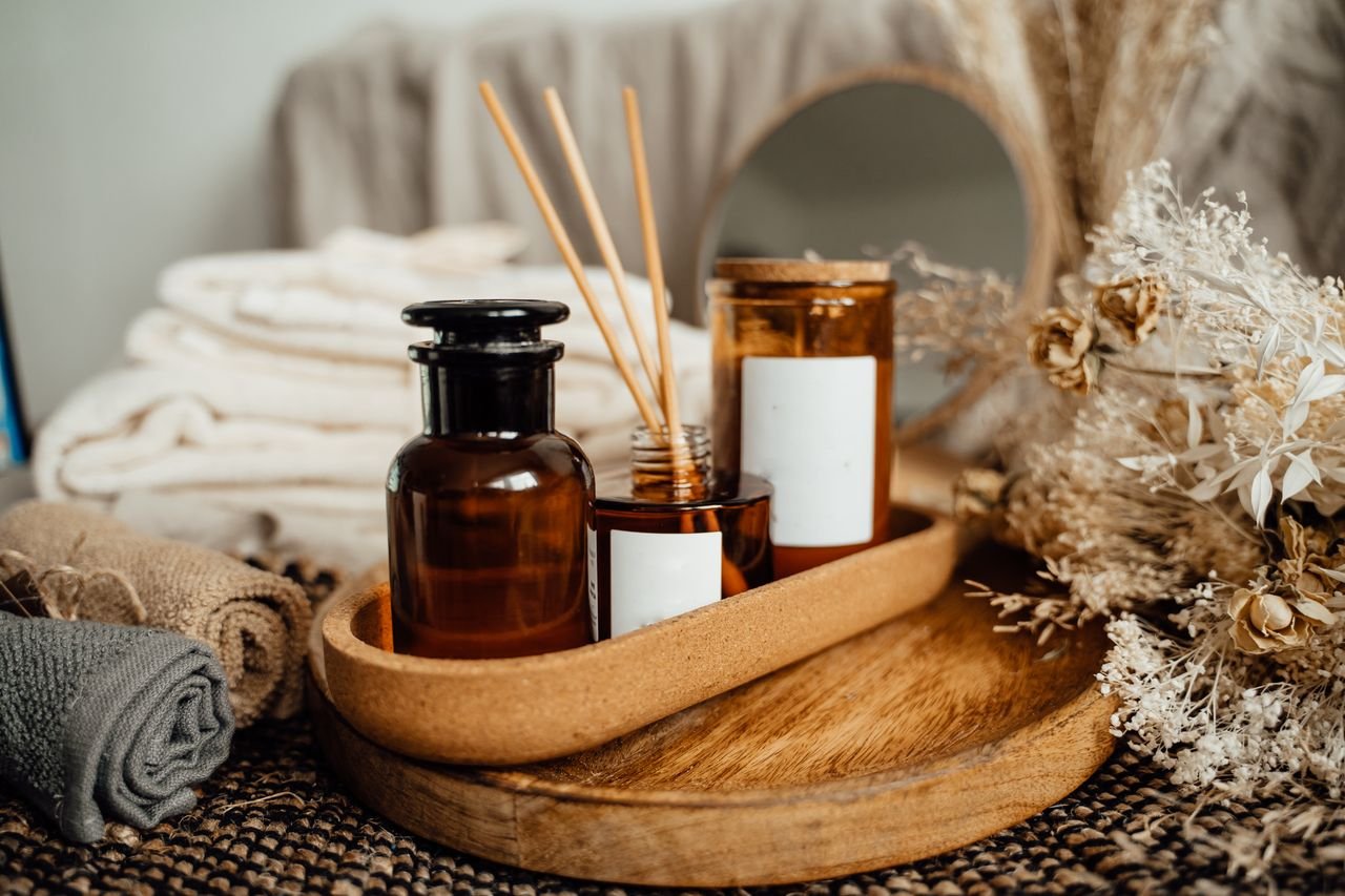 Services A tranquil spa setup featuring aromatherapy oils, candles, and dried flowers for relaxation.